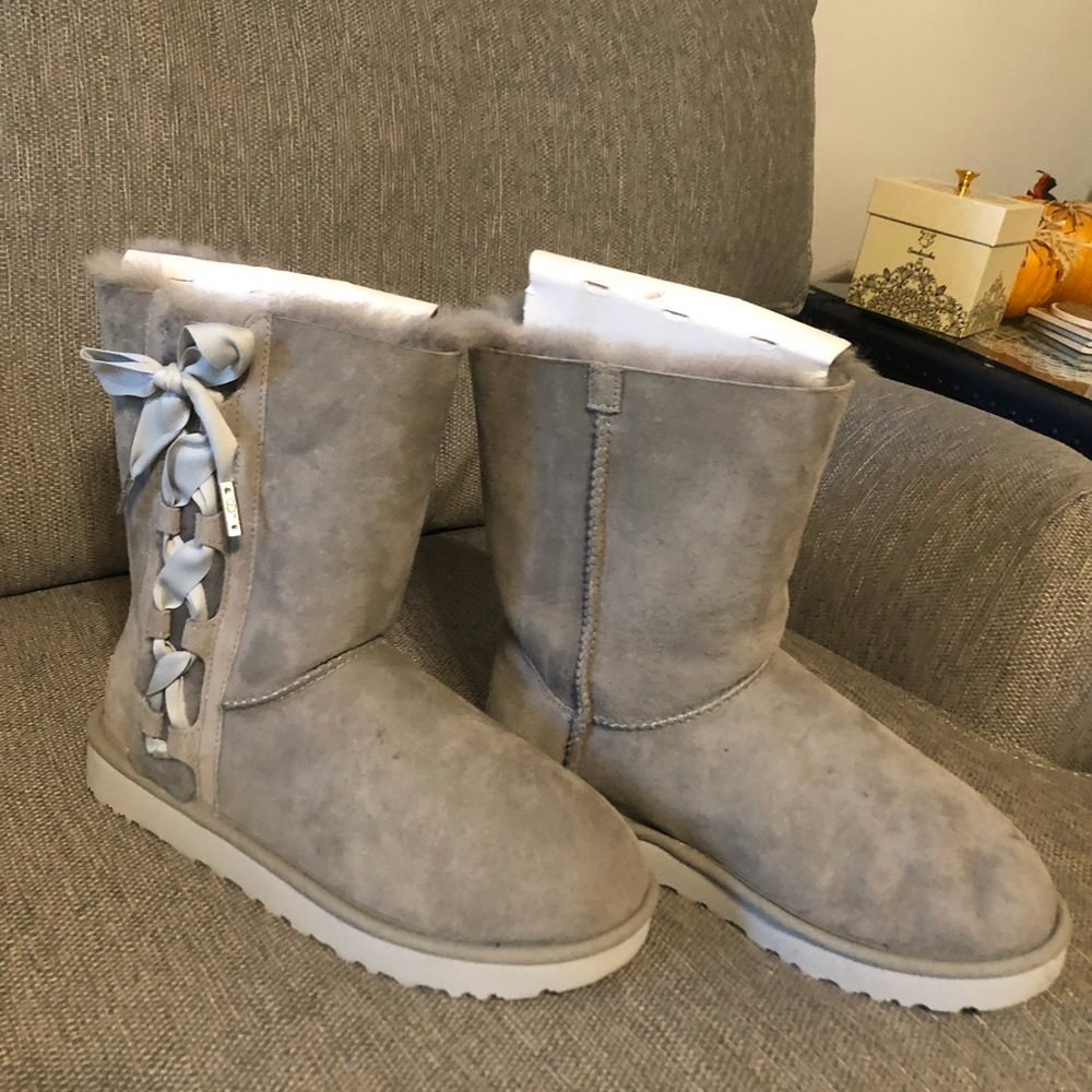 Grey Ugg boots with bows on side